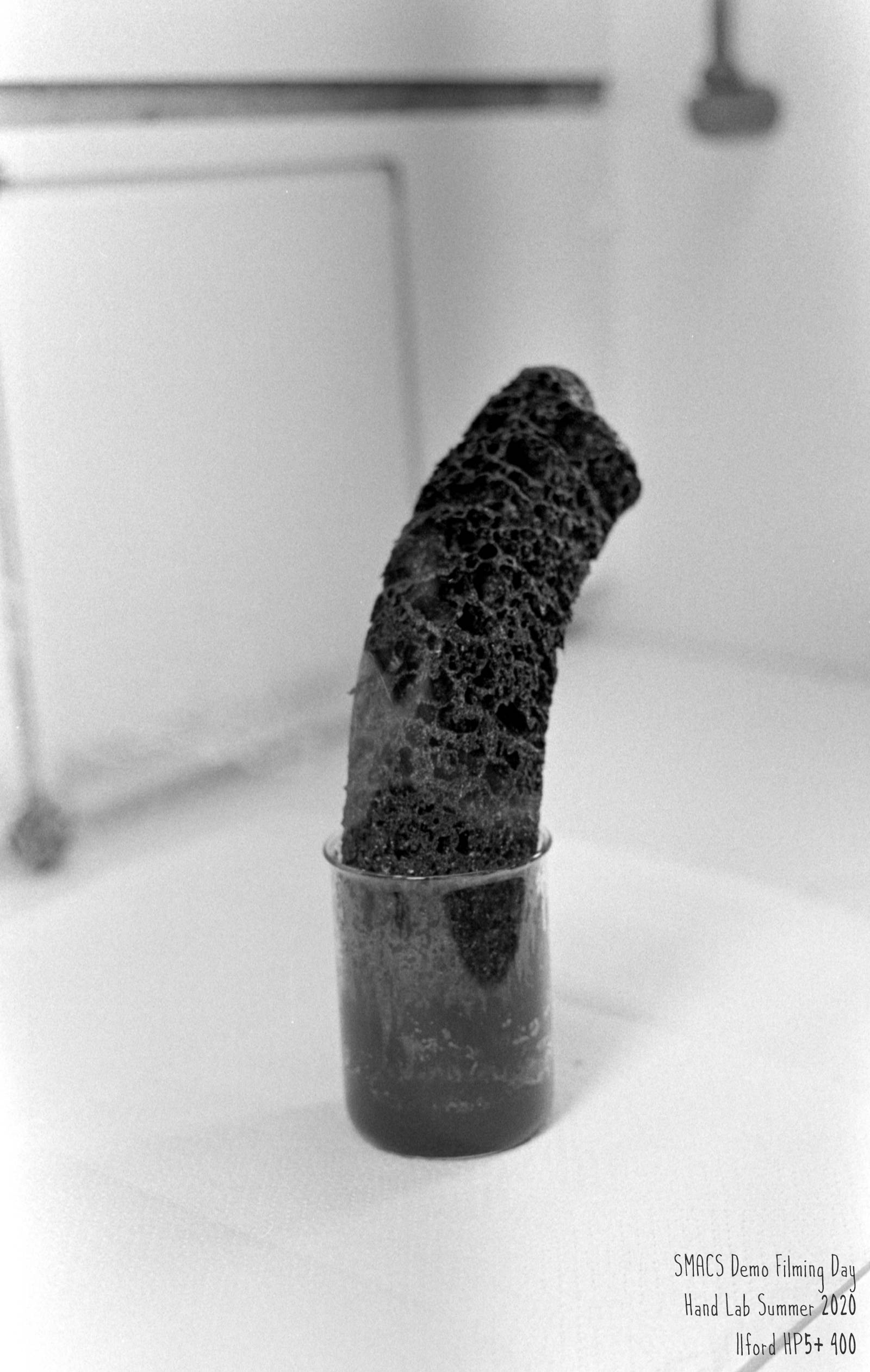Carbon column from the dehydration of sugar with concentrated sulfuric acid.